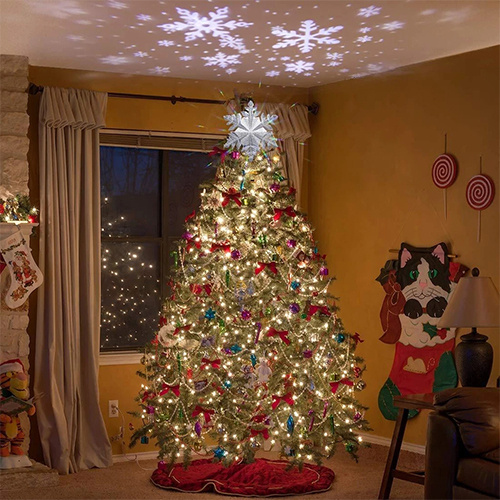 Christmas Tree Decorated With Stars Tree Topper Lit