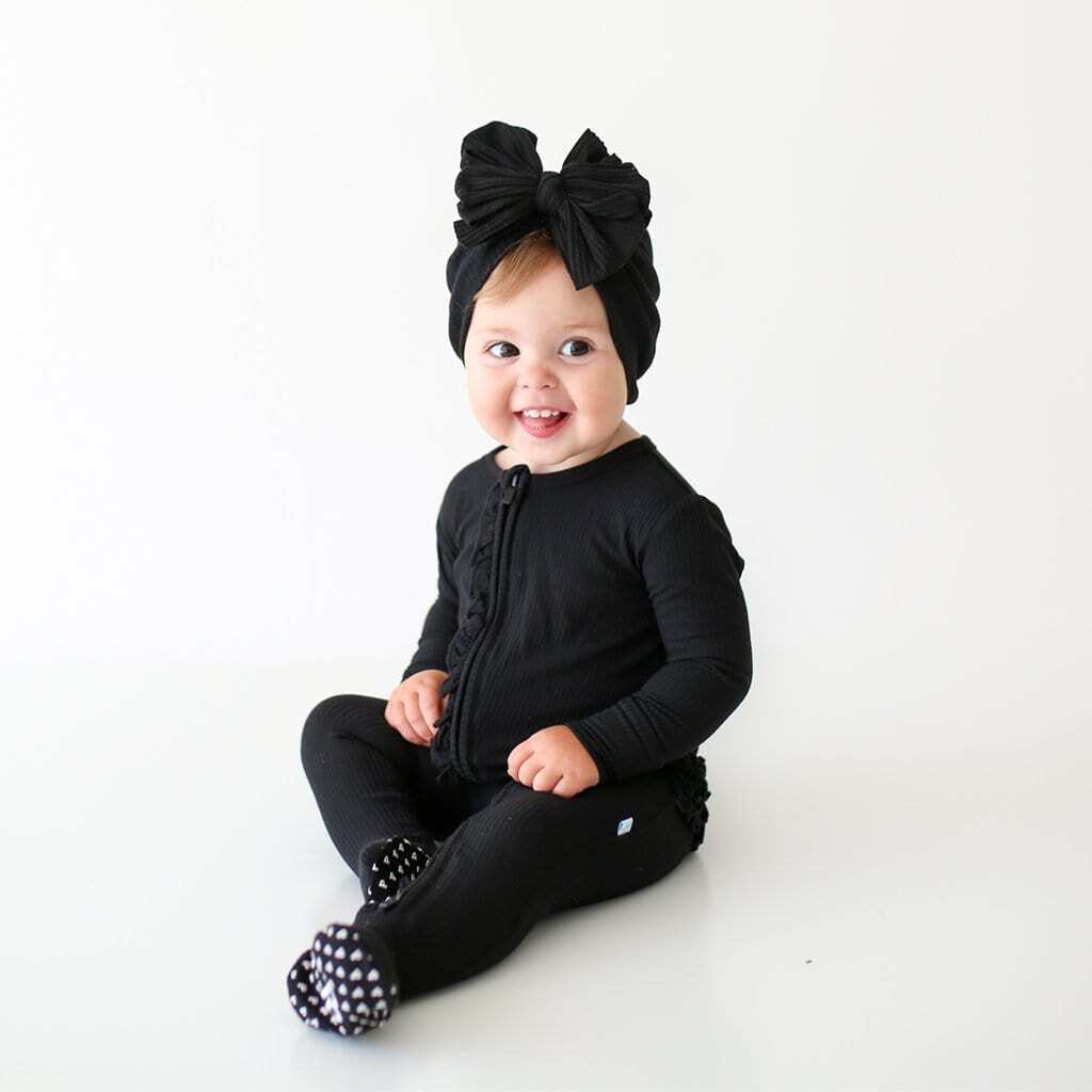 Black Ribbed Footie Ruffled Zippered One Piece